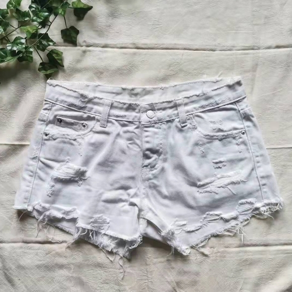 Pants - White distressed jean shorts.